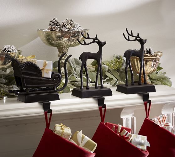 Santa Give Santa a ride on the mantel and add a reindeer for each family member. KEY PRODUCT POINTS • Made of iron and aluminum. • Bronze finish. • Felted underside protects surfaces. • Imported.